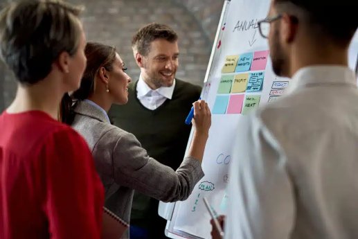 business-team-cooperating-while-making-new-plans-whiteboard-office-focus-is-businesswoman-writi.webp