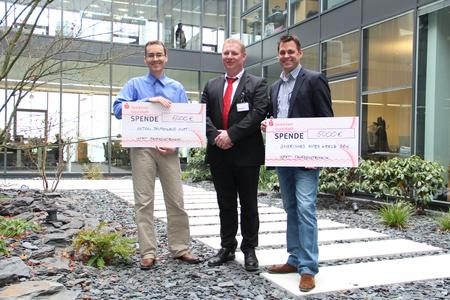 Cheque presentation with Dieter Hauenstein (centre), BRK's deputy head of local emergency operations, and BFFT directors Michael Mittag (left) and Markus Fichtner (right).