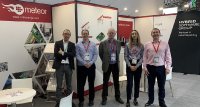 Kris Binon, AM Business Development Manager, poses with the Meteor Inkjet team during Formnext 2023 – the Hub for Additive Manufacturing