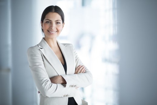 smiling-female-business-leader-with-arms-crossed.jpg
