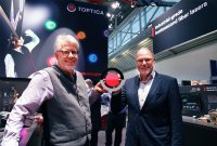 Dr. Wilhelm Kaenders (left) and Dr. Thomas Renner (right) present new TOPTICA logo and brand design at LASER World of Photonics 2022 in Munich.