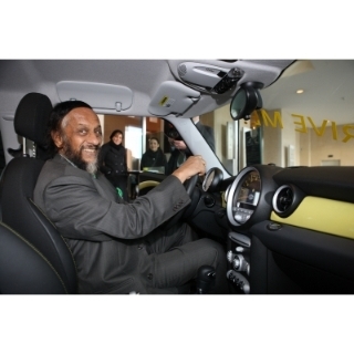 Emission free and still fun to drive: Nobel Laureate and Chairman of the UN IPCC (International Panel on Climate Change) Dr Rajendra Pachauri behind the whell of the all electric MINI E