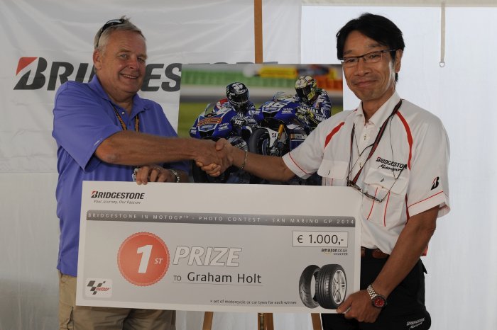 2014 winner Graham Holt presented his prize by Bridgestone Motorsport General Manager Kyota Futa.jpg