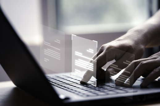 hand-using-laptop-computer-with-virtual-screen-document-online-approve-paperless-quality-assuran.jpg