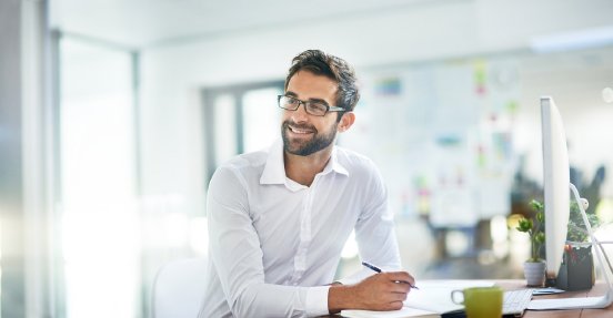 Cropped shot of a young businessman working in his office_iStock-532121446.jpg