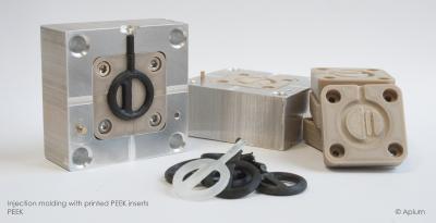 Figure 1: PEEK mold inserts with ABS(black) and Polyurethane(transparent) molded parts