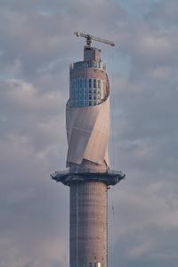The ThyssenKrupp elevator Test Tower in Rottweil, Germany, photographed during the complicated phase of membrane installation. The facade construction, made from delicate fiberglass mesh developed by Werner Sobek, is currently the world’s highest membrane project. Foto: Zooey Braun